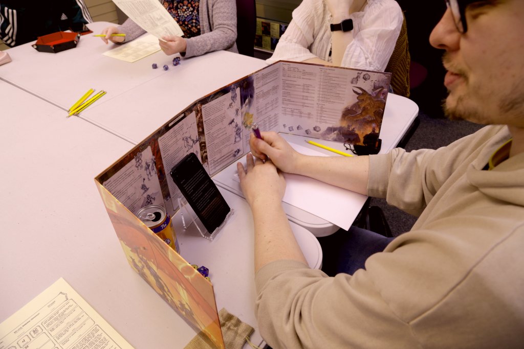 Resident dungeon master, Josh guiding the players through their first quest.