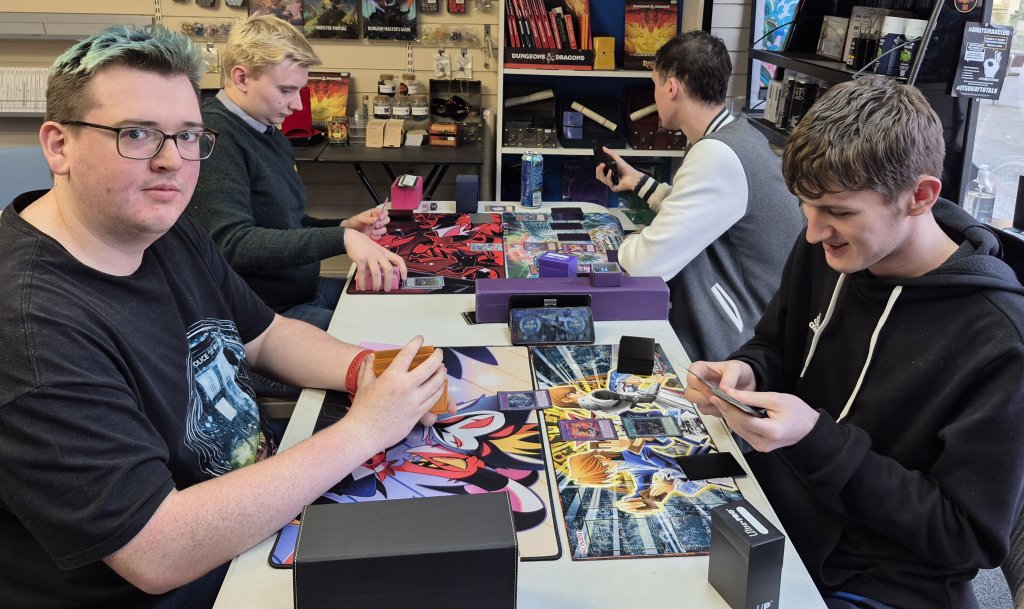 James, TJ, Joshua and Alex participating in one of the Yu-Gi-Oh OTS tournaments at the Guild of Games