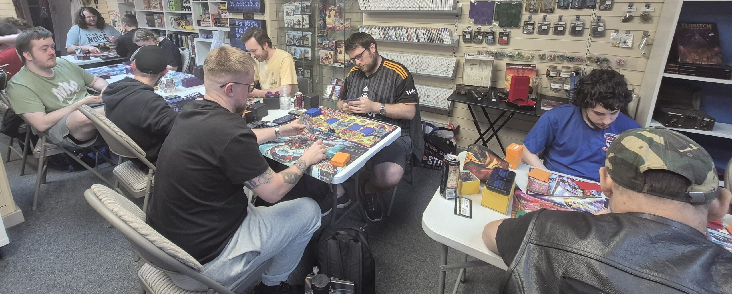 Yu-Gi-Oh tournament being played out  on the evening of Thu 12/06/2025