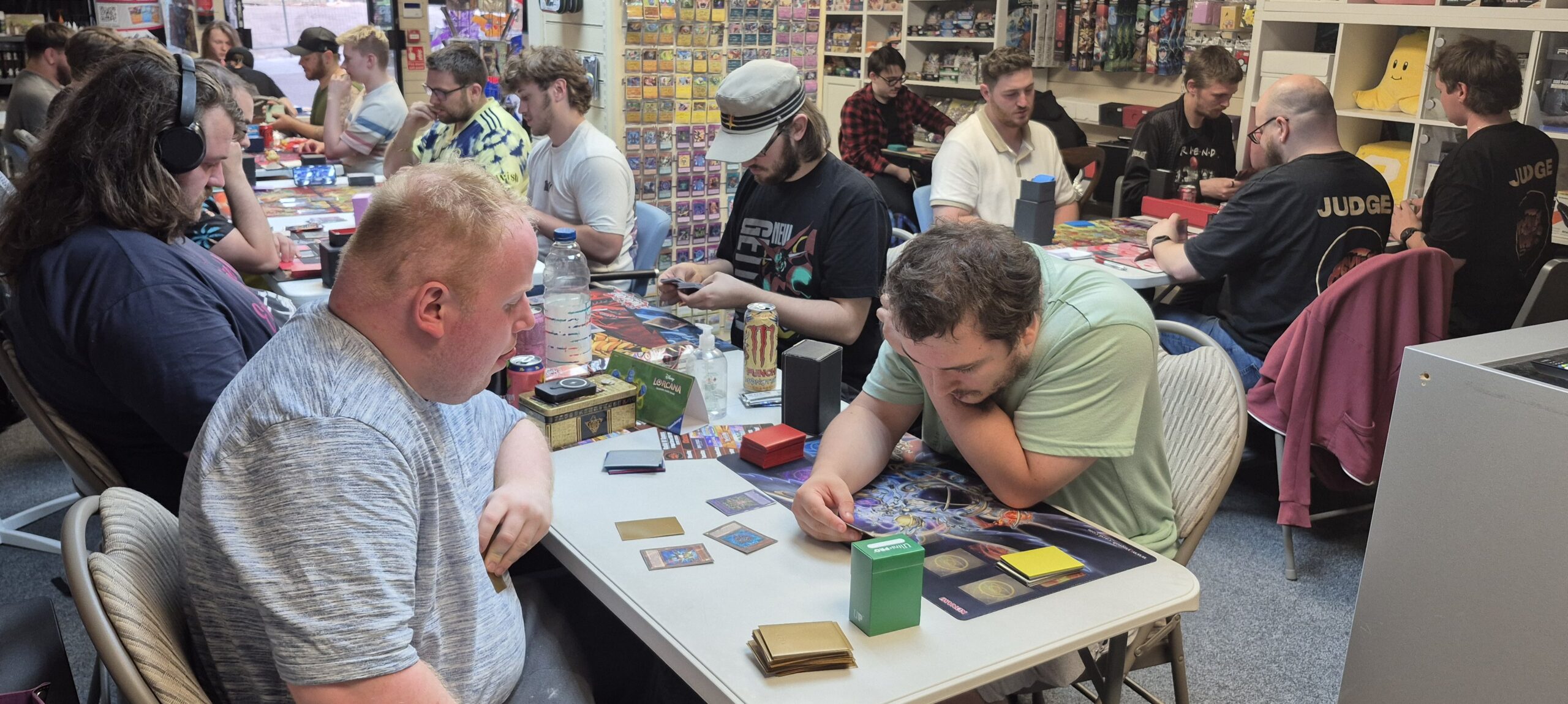 Visually impaired Ben with his brailed card sleeves duelling with Tom in 21 strong Yu-Gi-Oh OTS tournament at the Guild in ROTHERHAM on 10/07/2025