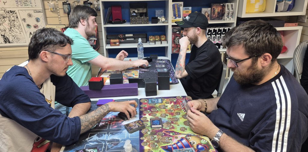 Alex (front left, clockwise), Leon, Johnathan and Michael taking part in the Yu-Gi-Oh OTS Tournament at Guild of Games