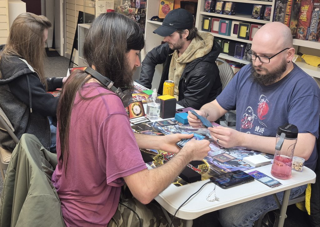 Elliott, Josh, Regan and Ellis duelling in the Yu-Gi-Oh OTS Tournament at Guild of Games on Thu 02/04/2026